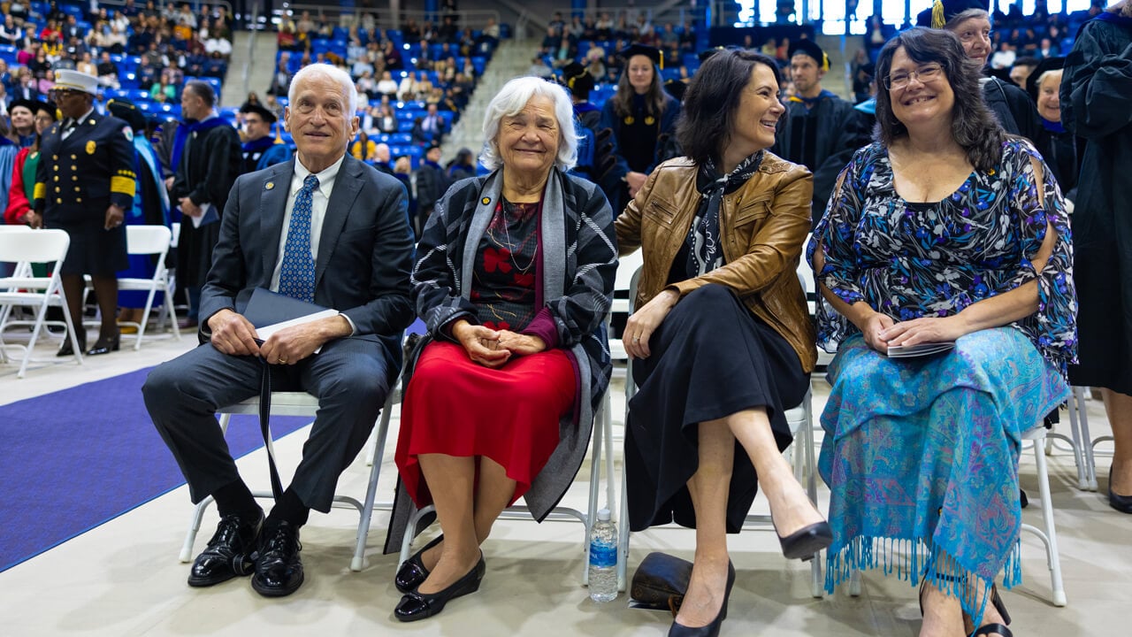 Marie Hardin's family sits in the front row and smile before the Inauguration ceremony