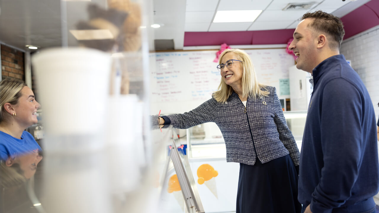 Marie Hardin reaches across the counter at Kelly's Cone Connection