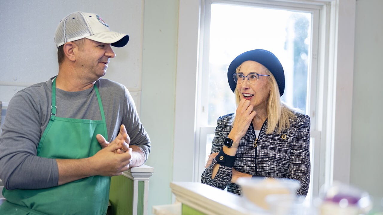 Marie Hardin talks with a staff member at Wentworth's ice cream
