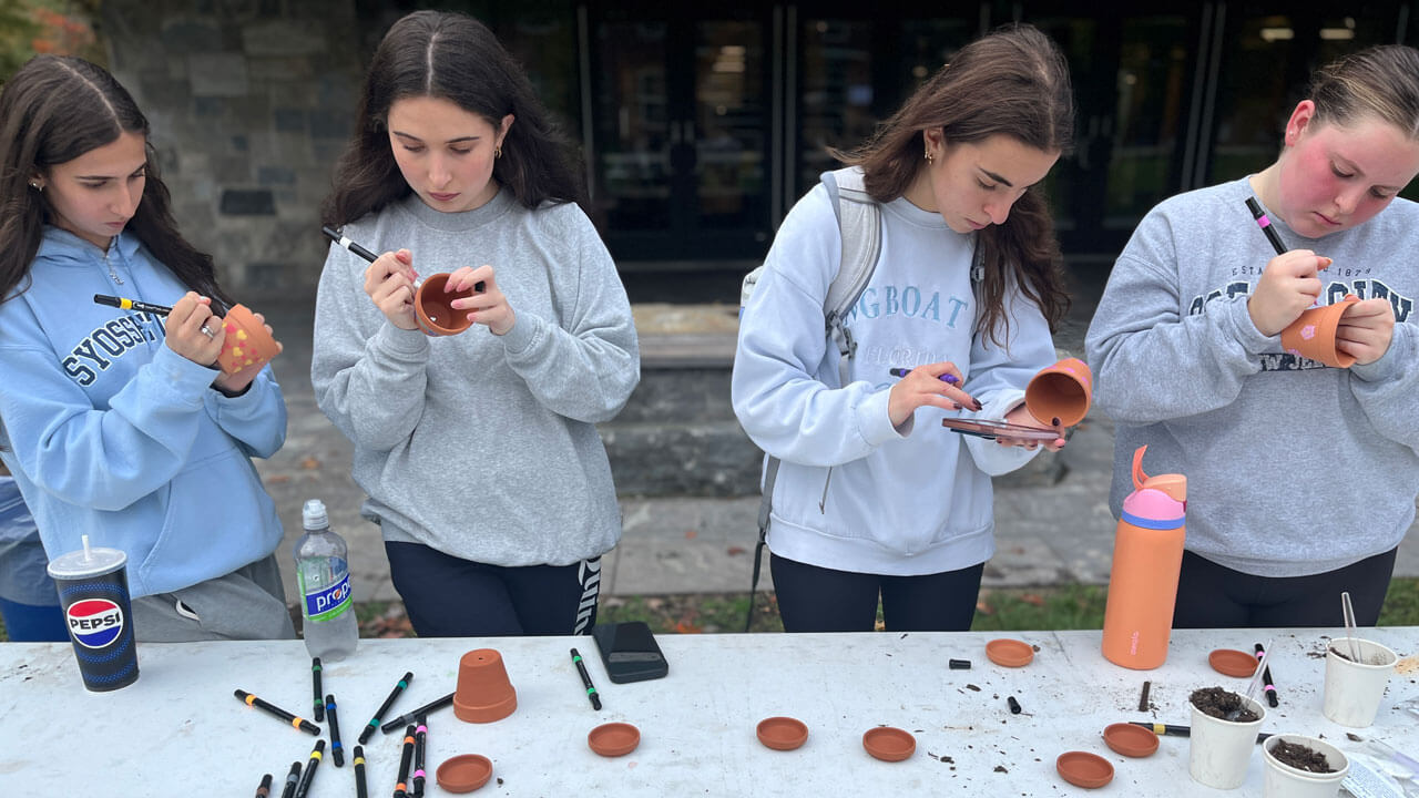Students paint planting pots