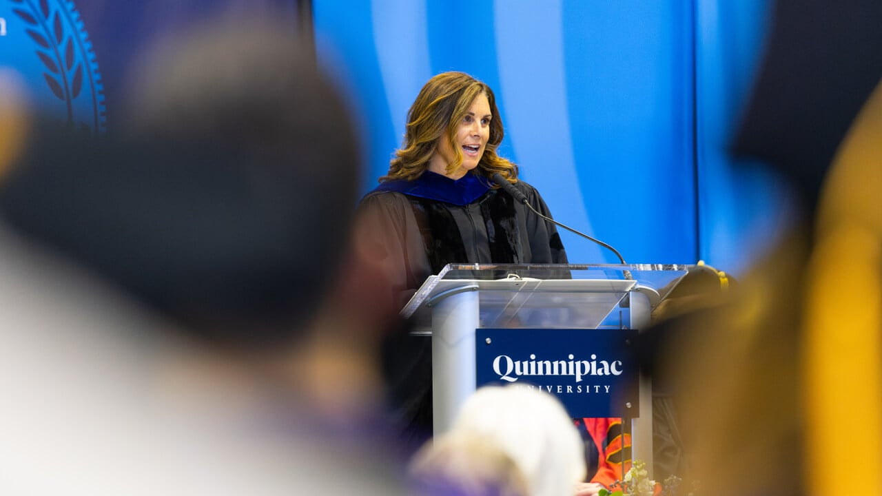 Jeanna Doherty ’94 speaks at the Quinnipiac podium