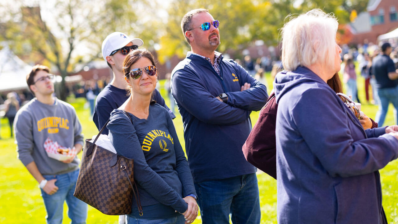 Parents standing together on the quad