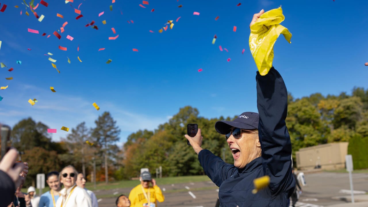 President Hardin shows excitement with confetti in the air