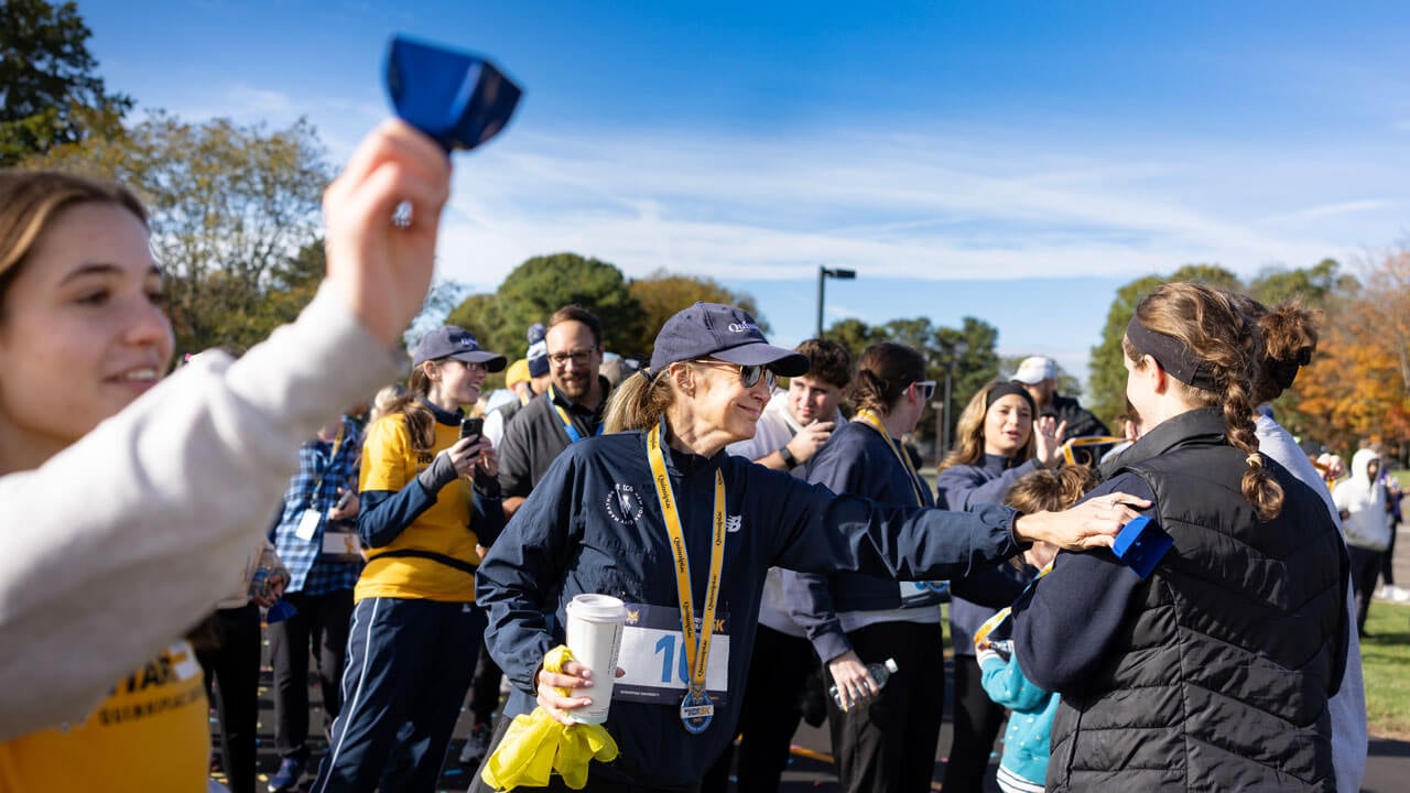 President Hardin showing support to a runner after finishing the race