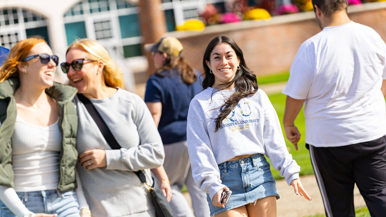 Families laugh on the quad together