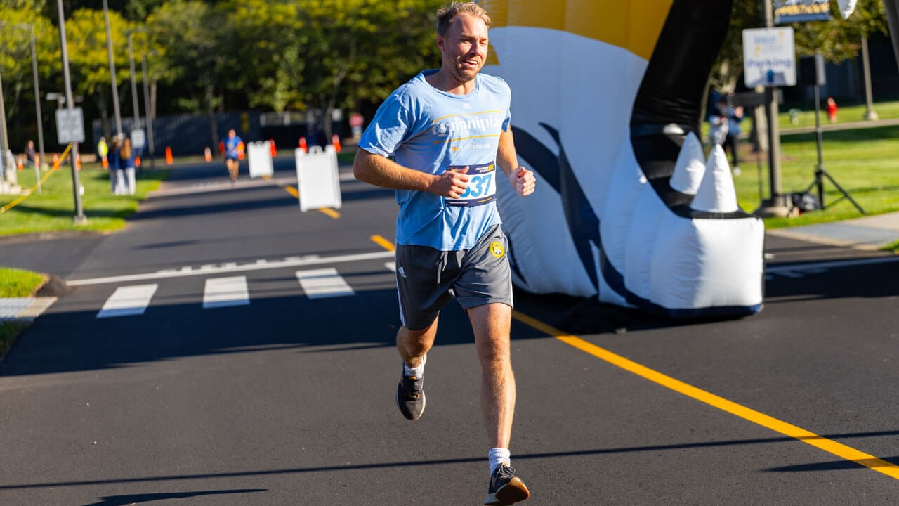 Runner in action with smile during the race