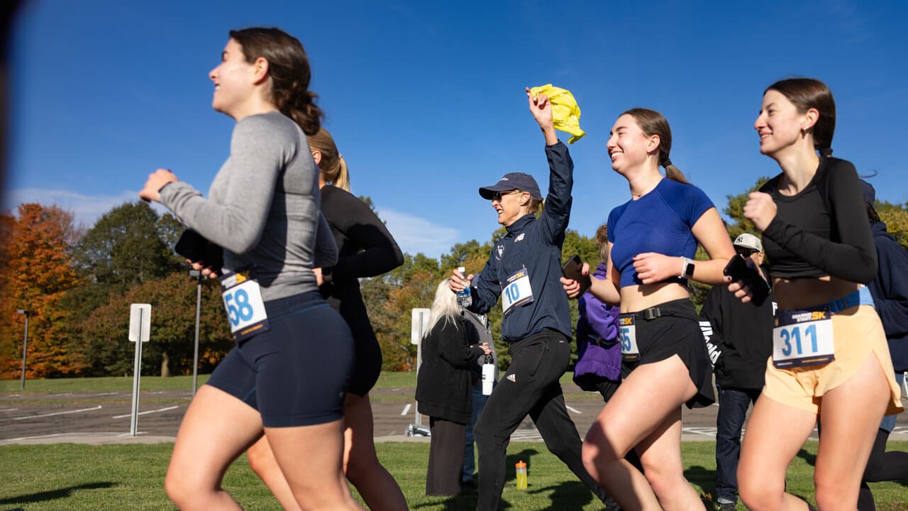 Students running alongside President Hardin