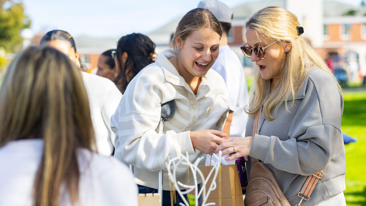 Student and family member look in a goody bag