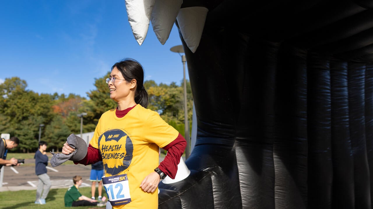 Associate Dean Anita Lee finishing the race with a smile