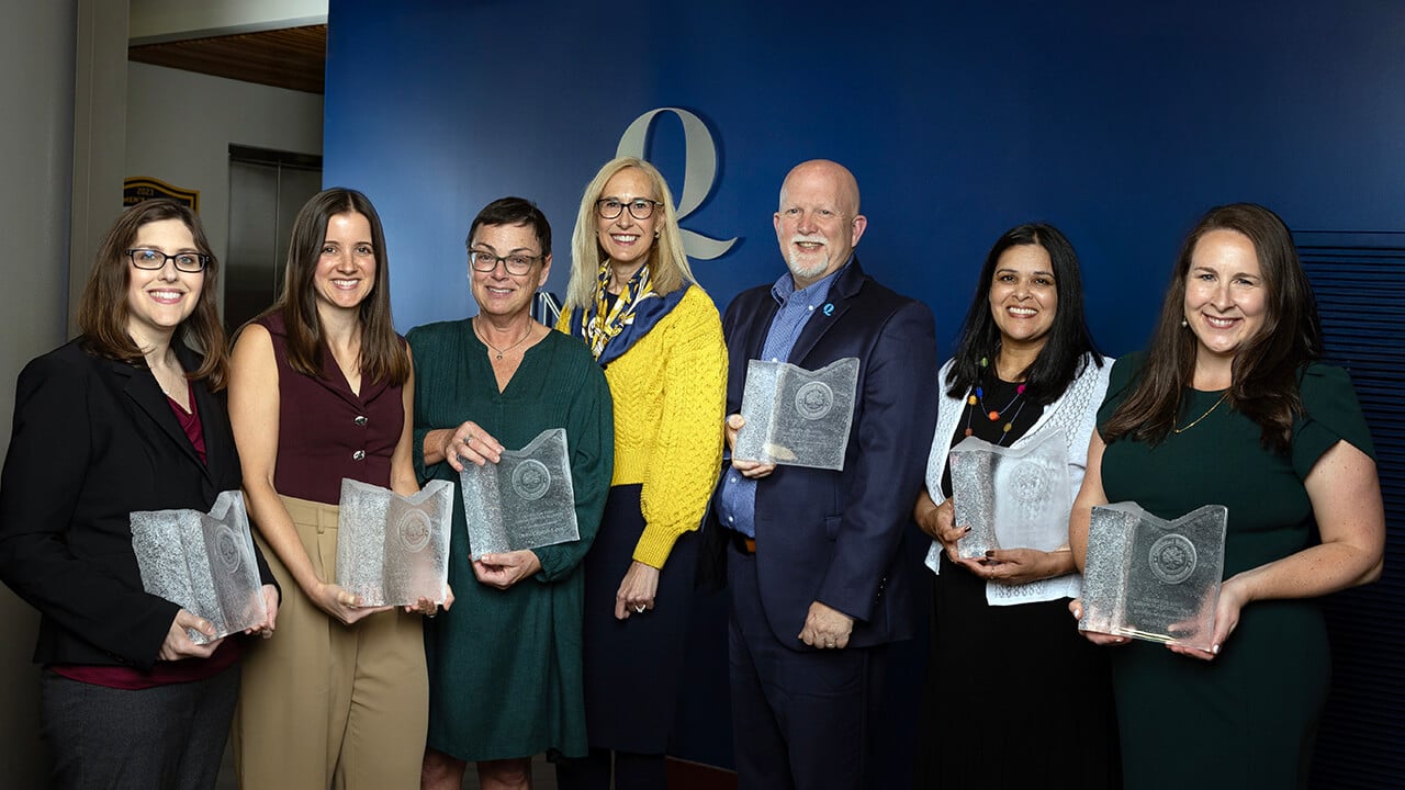 Honorees pose with their awards