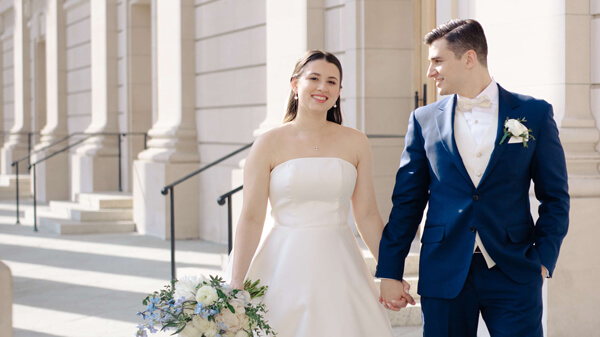 Ephemia Nicolakis and Loukas Agoris hold hands on their wedding day