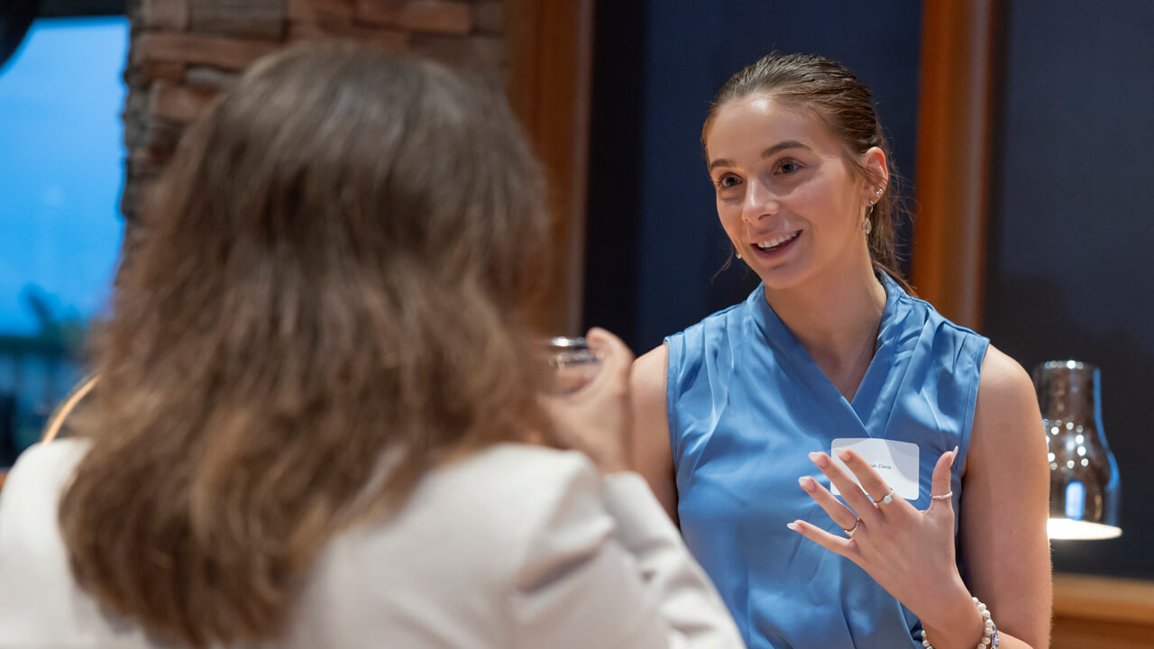 A close shot of a female student talking to someone