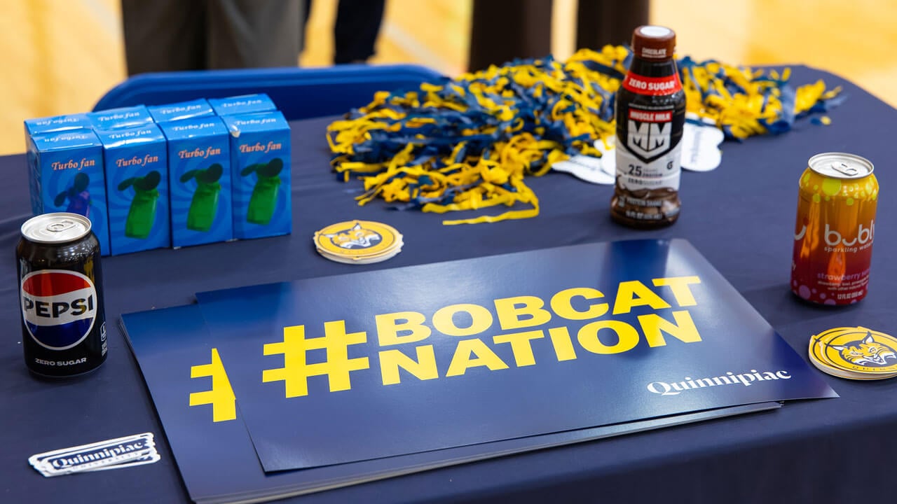 Table spread featuring Pepsi products and a Bobcat Nation sign