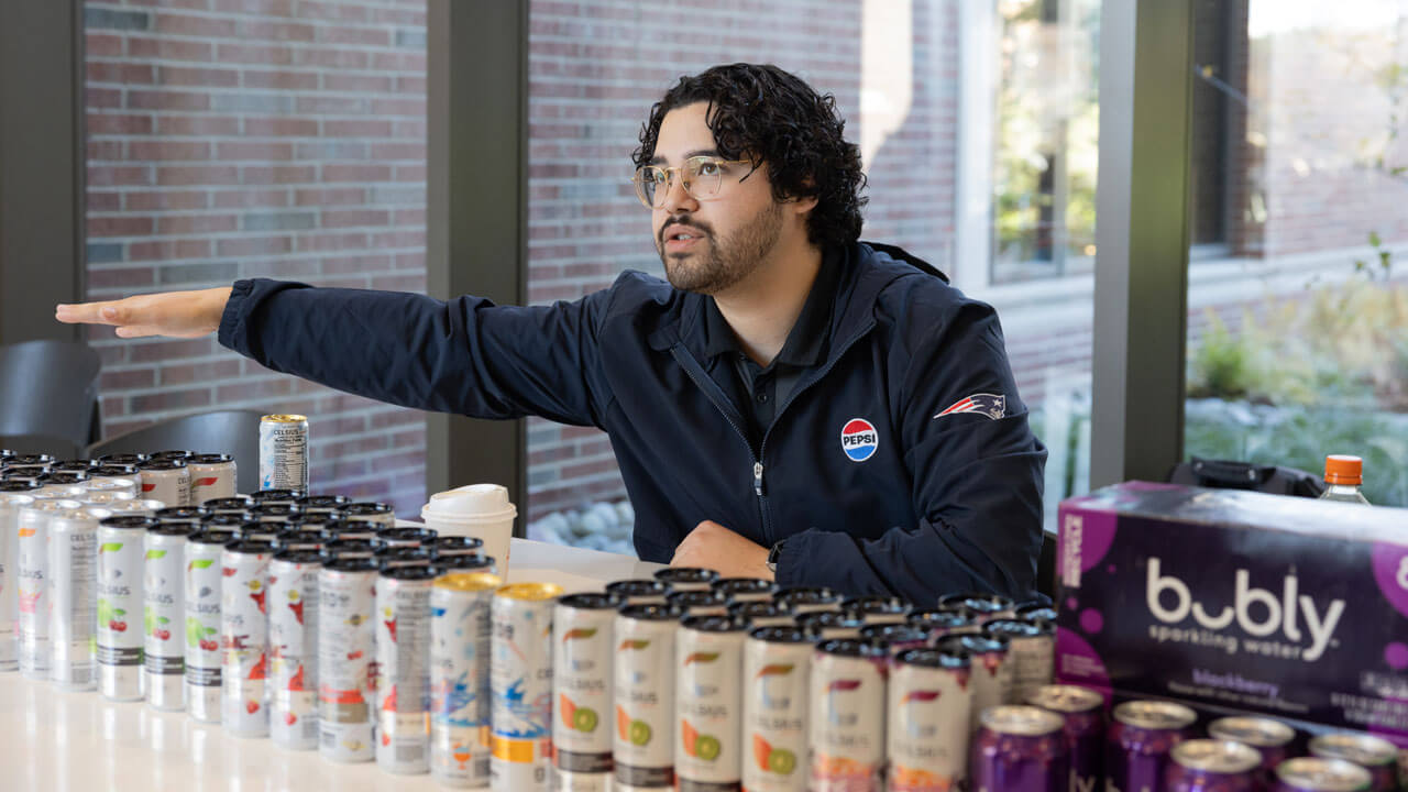 Pepsi employee presents products
