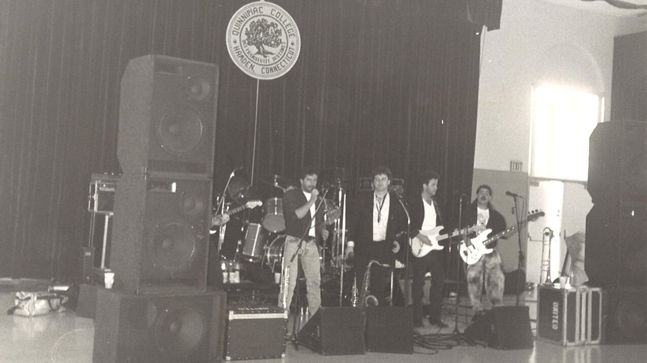 Group of students playing instruments on a stage