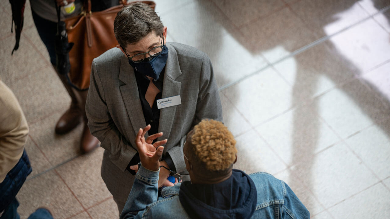 Provost having a conversation with someone in CCE