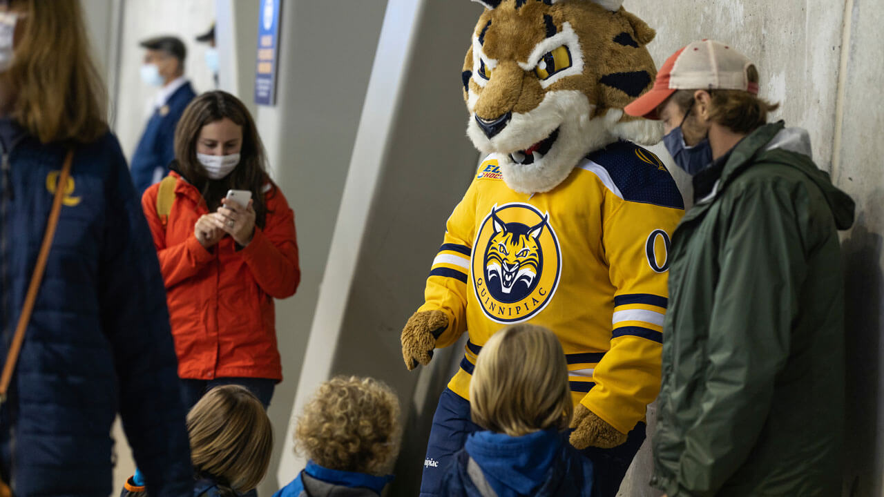 Boomer with children and parent while waiting at hockey game