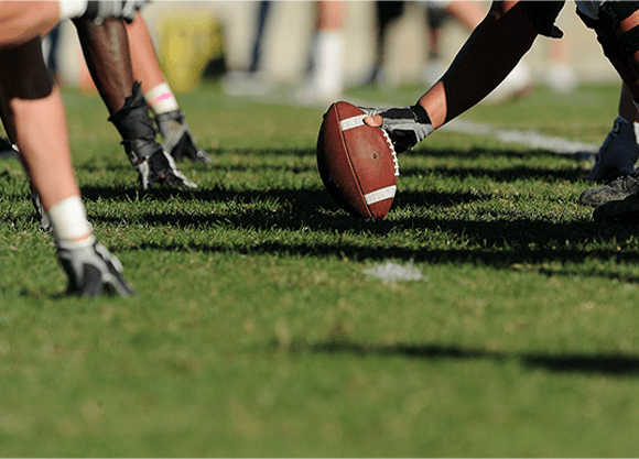 A football on a turf field