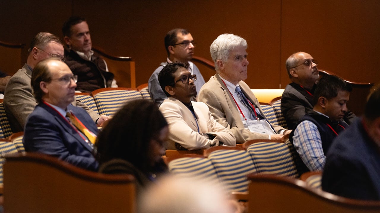 Crowd listens to speaker intently