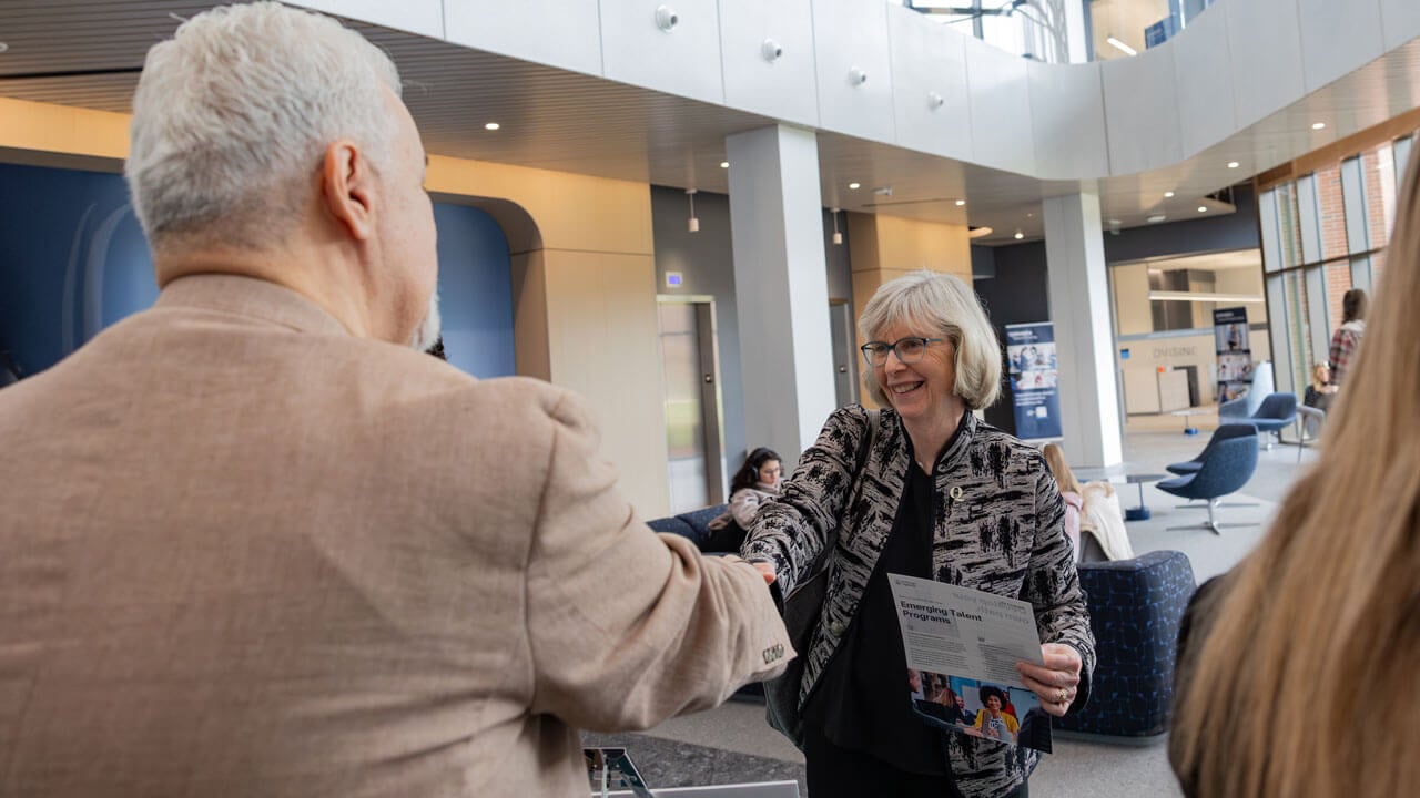 Individuals exchanging a handshake