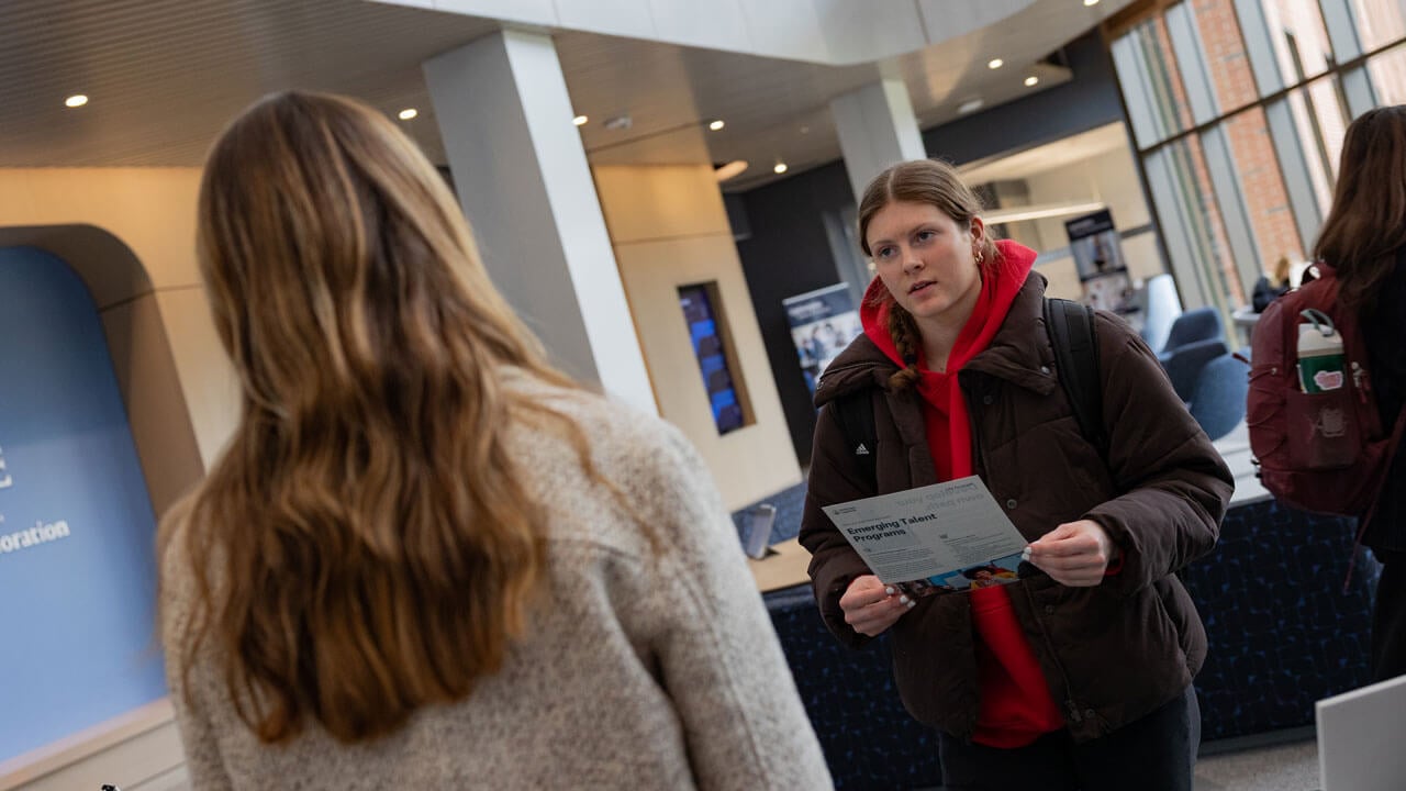 Student holding a Boehringer Ingelheim pamphlet