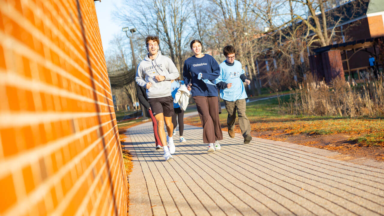 Students running in the 2025 Jingle Bell Fun Run