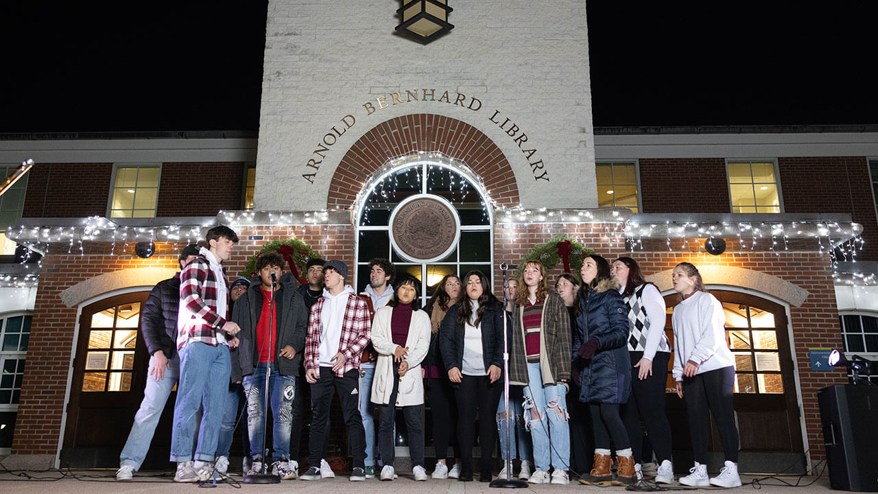 One of Quinnipiac's a capella group sings on the library steps