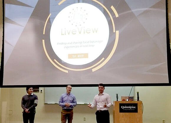 Students pitch their business plans to audience