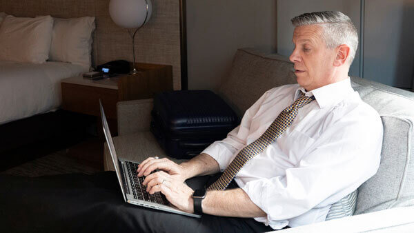 An online student studies with his laptop