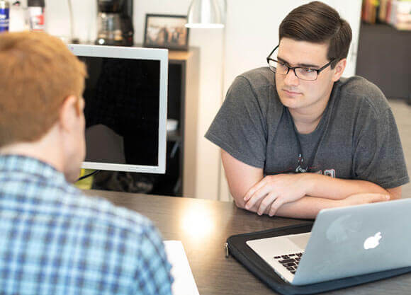 Student working with an adviser.