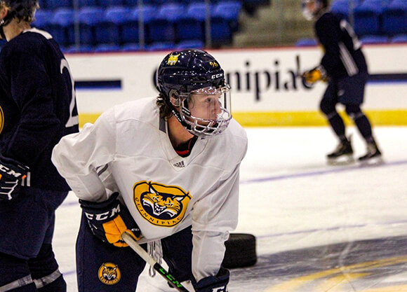 Skates on the ice in his Quinnipiac bobcats jersey